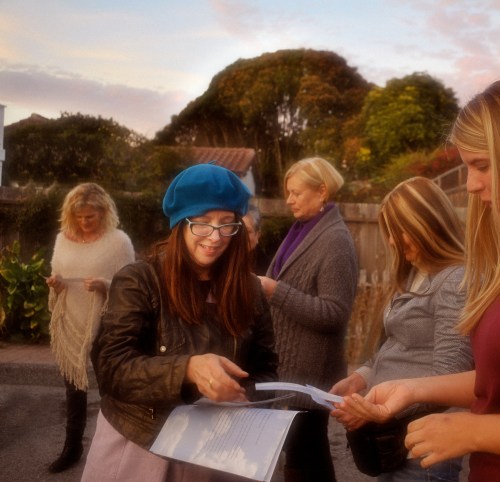 Judith passing out poems