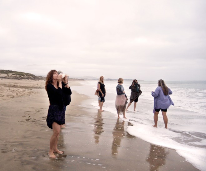 Bold women wading in the water to call upon the spirit of Freyja